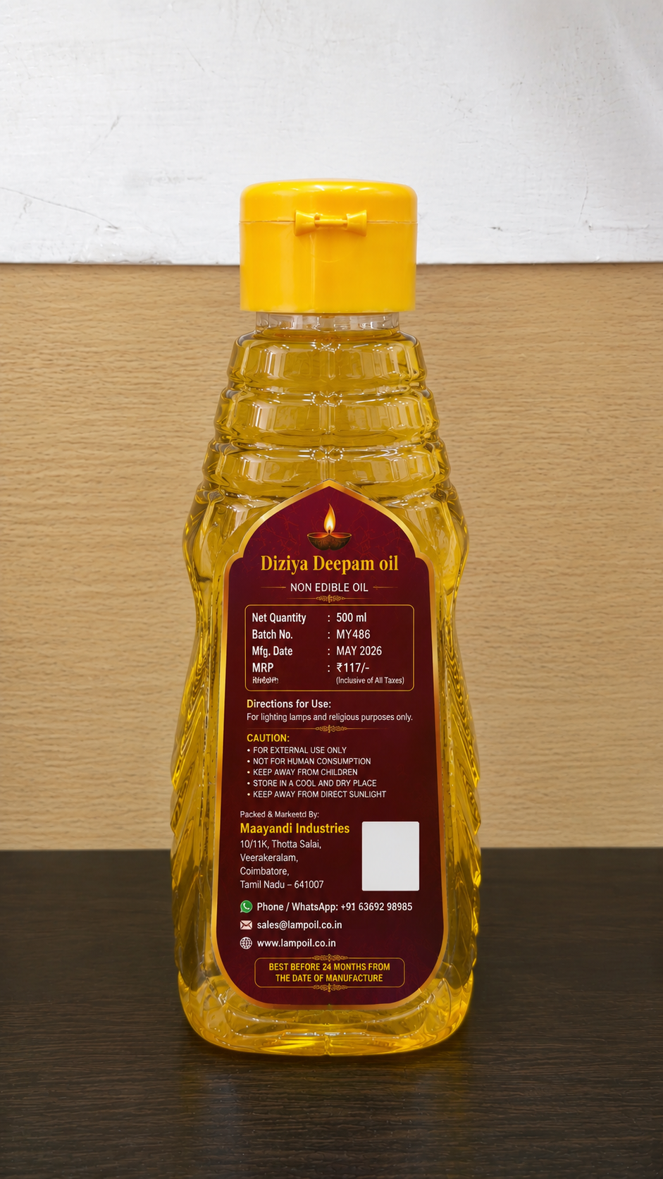 Dizhiya Deepam Oil 500ml back view showing product information usage instructions and safety details